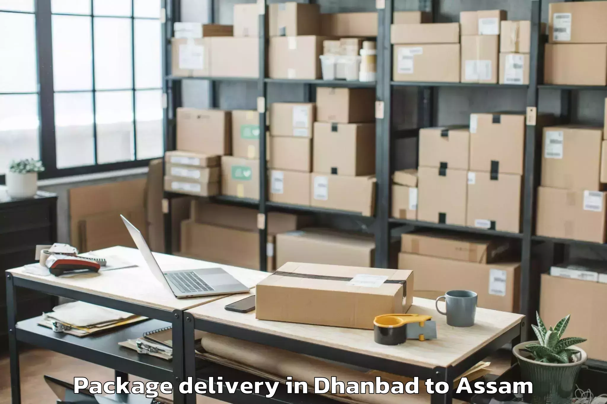 Professional Dhanbad to Rajakhat Banekuchi Package Delivery